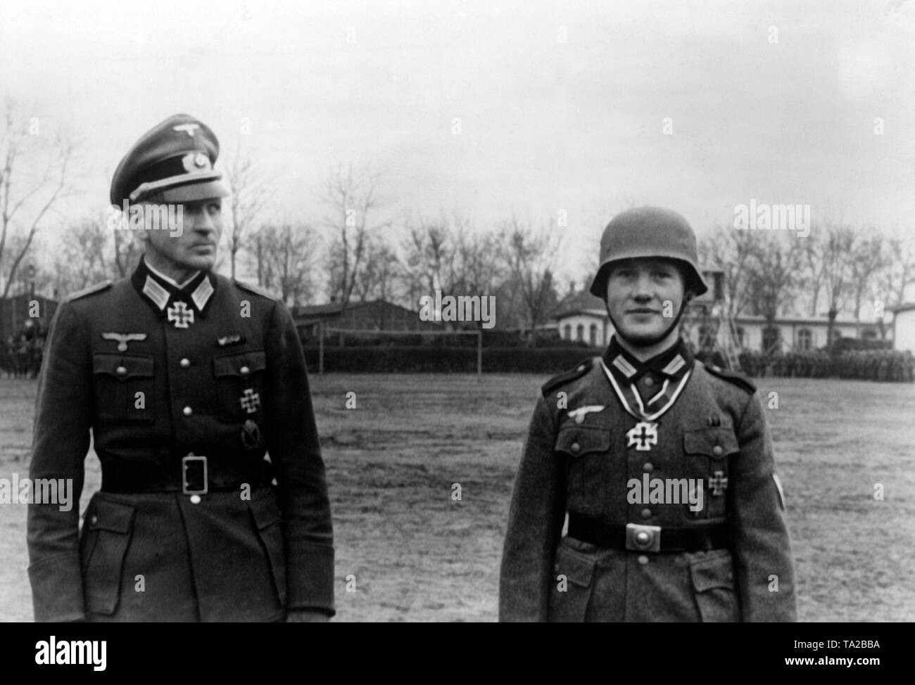 Private Hubert Brinkforth (right) after the awarding of the Knight's Cross to the Iron Cross. His battalion commander Freiherr von Hardenberg is on the left. Brinkforth was the first member of the team, who was awarded the Knight's Cross. Stock Photo