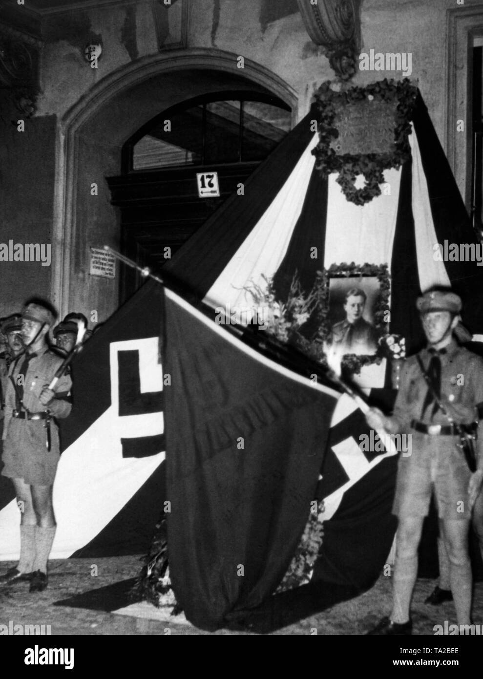 During a memorial service of the Hitlerjugend for the Hitlerjunge Hans Hoffmann, who was murdered on the Lausitzer Platz on 17 August 1931, the HJ flags are lowered while attendants are singing the 'Lied vom guten Kameraden' ('song of the good comrade'). Stock Photo