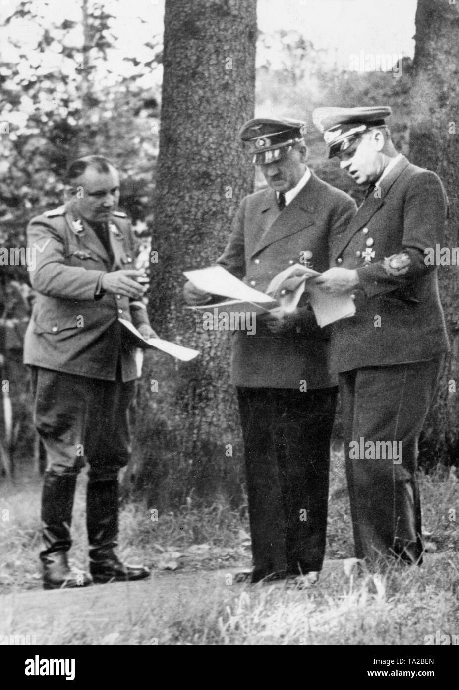 From left to right: Martin Bormann, Adolf Hitler and Joachim von Ribbentrop during a meeting at Wolf's Lair(German: Wolfsschanze), Adolf Hitler's first Eastern Front military headquarter in World War II Stock Photo