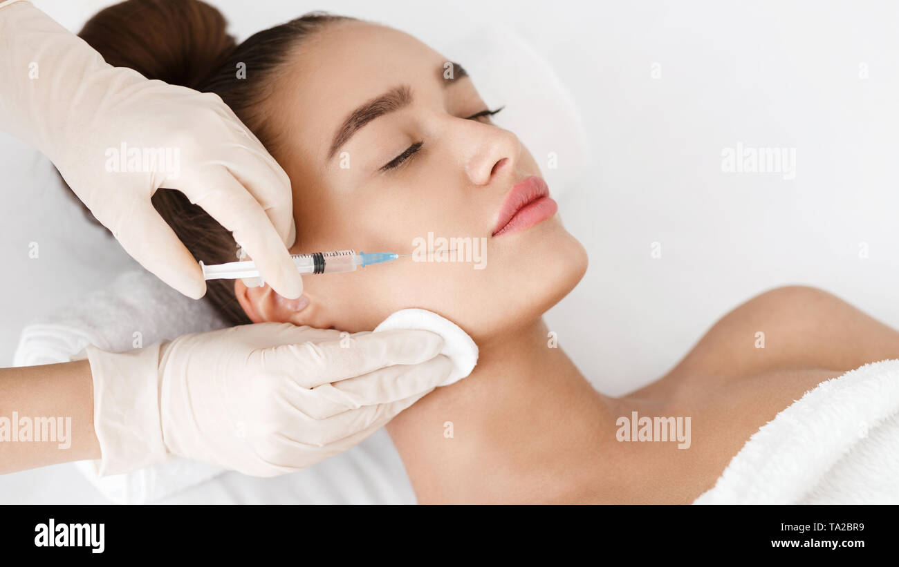 Anti Wrinkle Surgery. Young Woman Receiving Injection Stock Photo