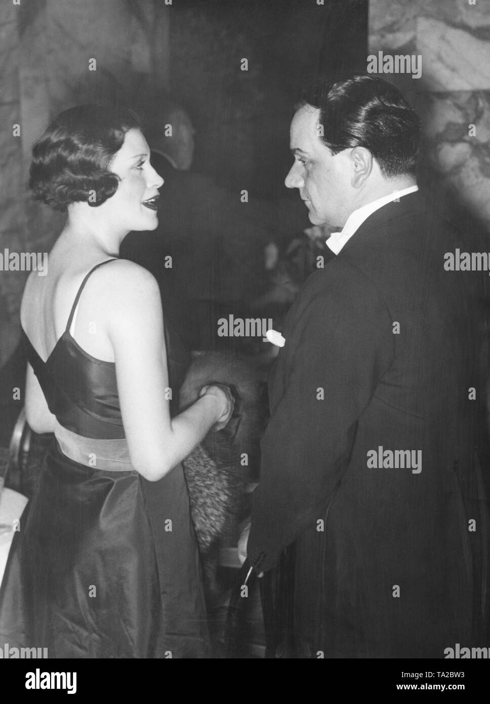The actress Sybille Schmitz with the director Harry Piel in conversation at the Film Ball in Berlin. Stock Photo