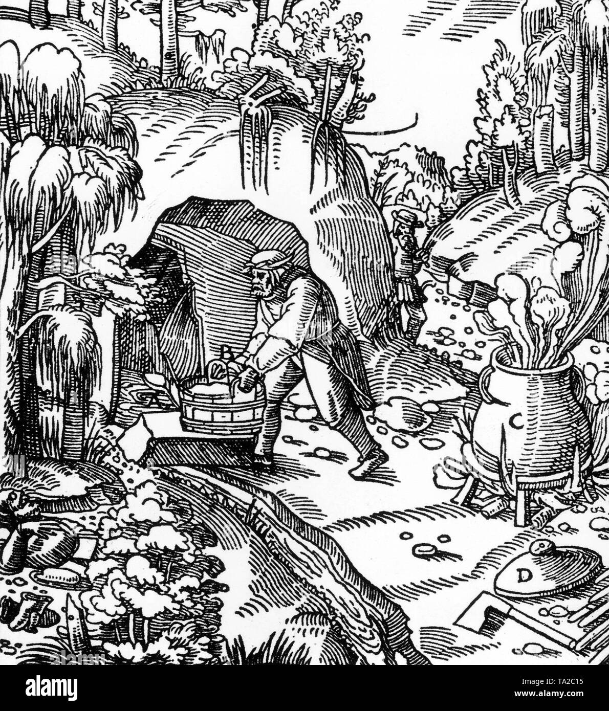Presentation of the crude oil production by absorption of water (A and B) and distillation of the oil in a kettle (C) with lid (D). The oil was used for lamps and torches, as a wood preservative and as cart grease. The drawing is from the book "De Re Metallica" by the Saxon scholar Agricola (1494 -1555), one of the founders of geoscience. Stock Photo