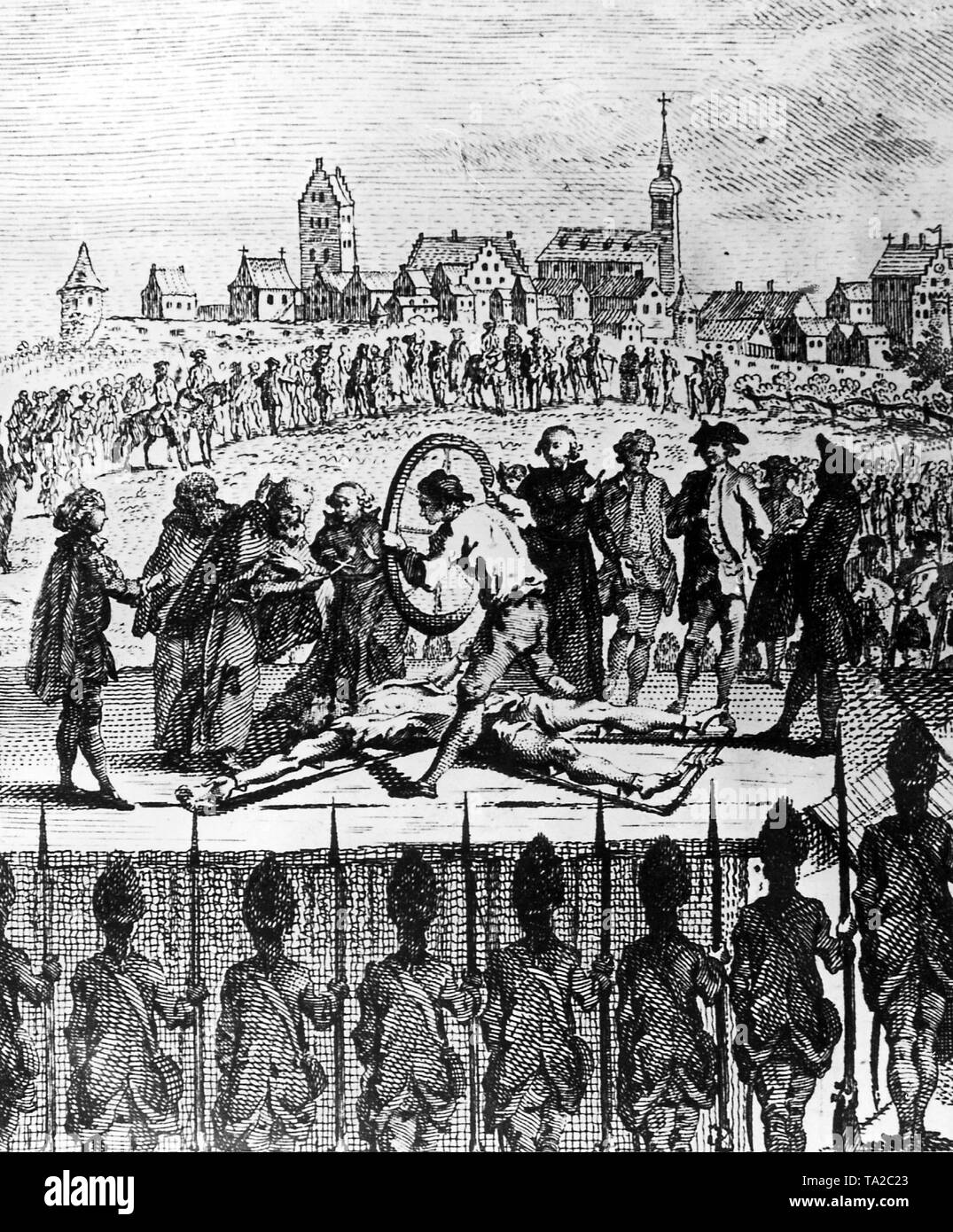Execution of poacher and folk hero Matthias Klostermayr, called the 'Bavarian Hiasl' in Dillingen an der Donau on 1 September 1776. The bones of the delinquent are shattered by the helper of the executioner with a heavy wagon wheel, while a minister holds a cross at his face as a consolation. Stock Photo