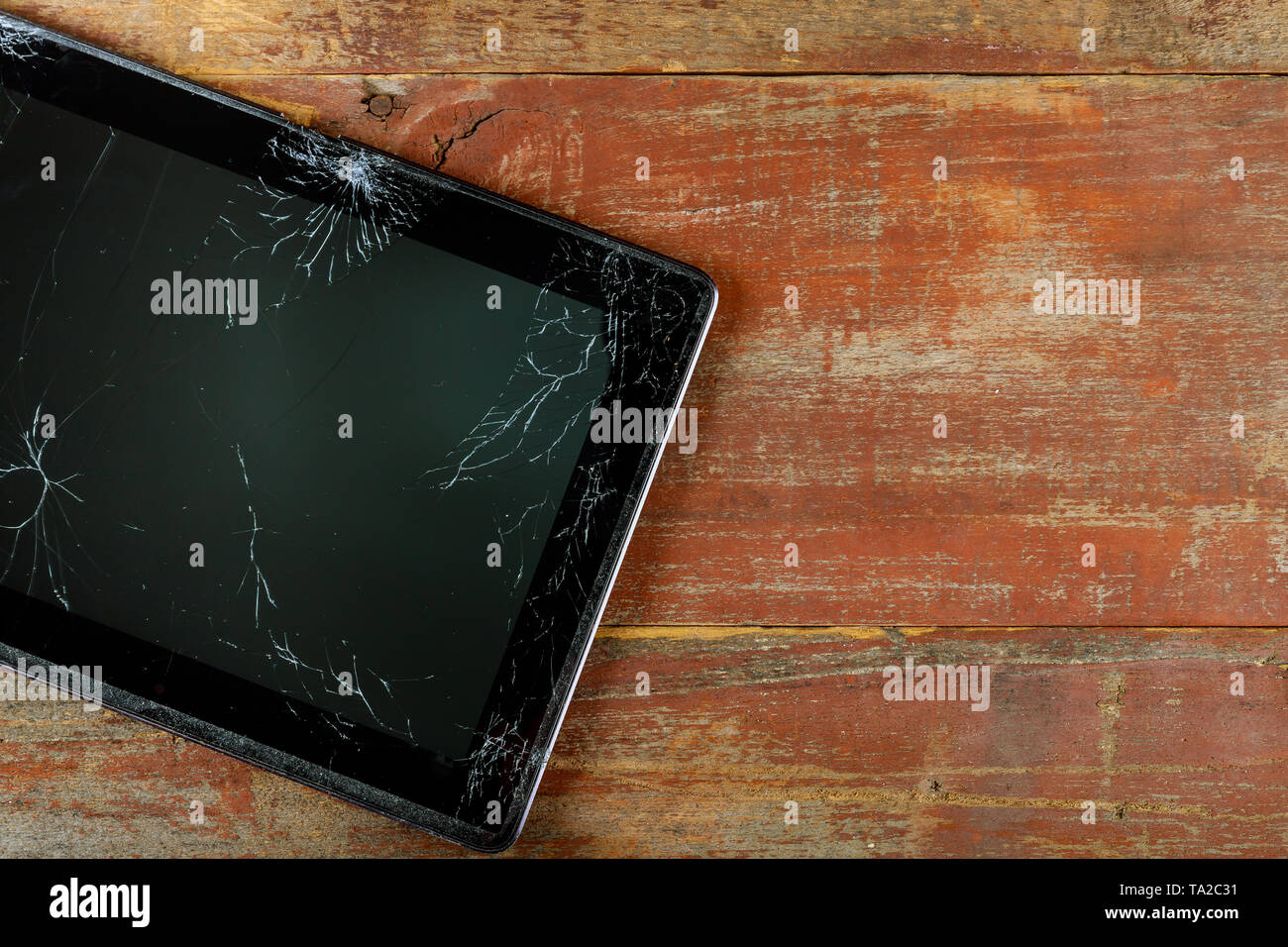 Cracked tablet digital computer with broken screen Stock Photo