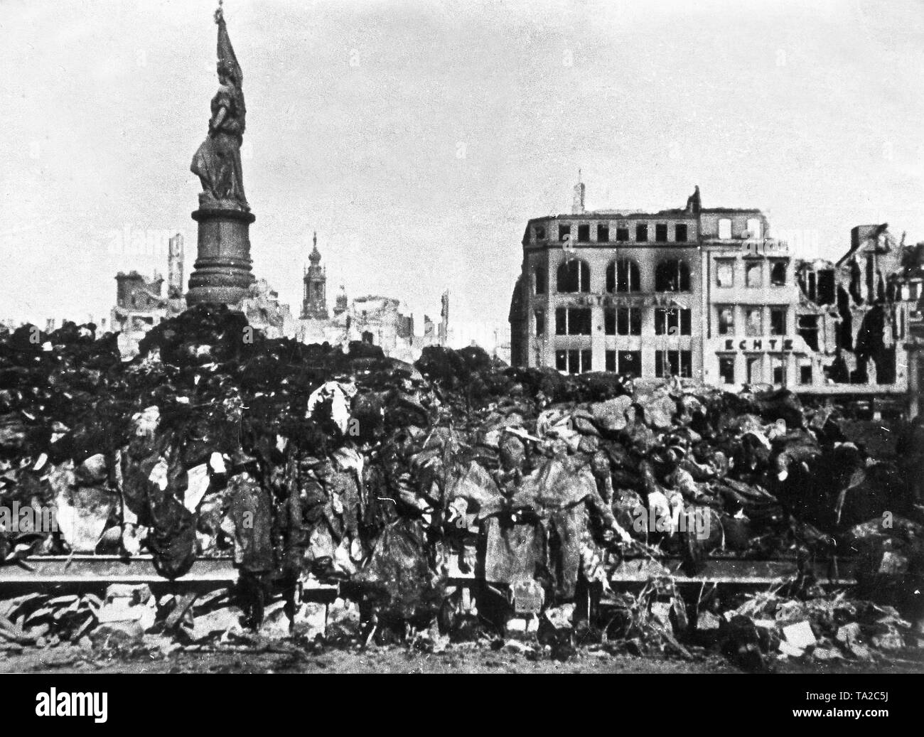 Dead bodies piled up to be burned following the Allied Bombing of Dresden, 13th -15th February 1945 (b/w photo). c. 30,000 civilians were killed during the British air raid in February 1945, Stock Photo