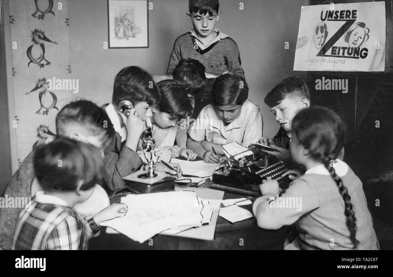 'Session' in the editorial office of a children's newspaper in Berlin. About 20 children between the ages of 10 and 16 publish a newspaper entitled 'Unsere Zeitung, Jugend fuer Jugend' ('Our Newspaper Youth for Youth'), where they are responsible for editing, printing and operations. Stock Photo