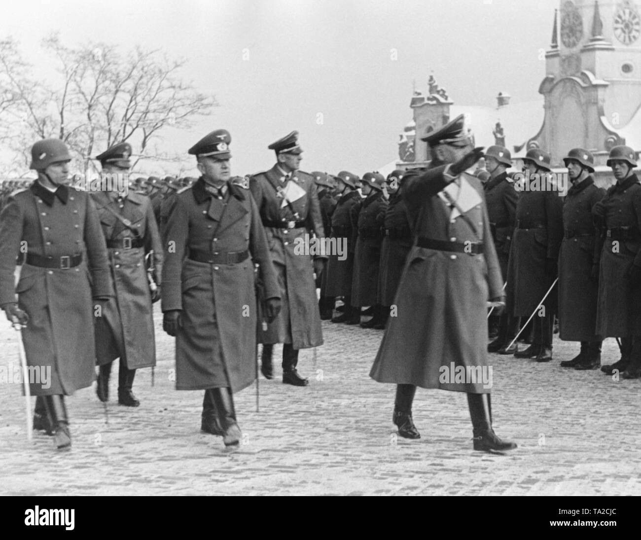 The Reich Protector for Bohemia and Moravia, Konstantin von Neurath, inspects a guard of honor. Behind him, the Secretary of State of the Reich Protectorate of Bohemia and Moravia, Karl Hermann Frank (left) and General Erich Friderici. Since March 1939, the areas of Bohemia and Moravia had been under German occupation. Stock Photo