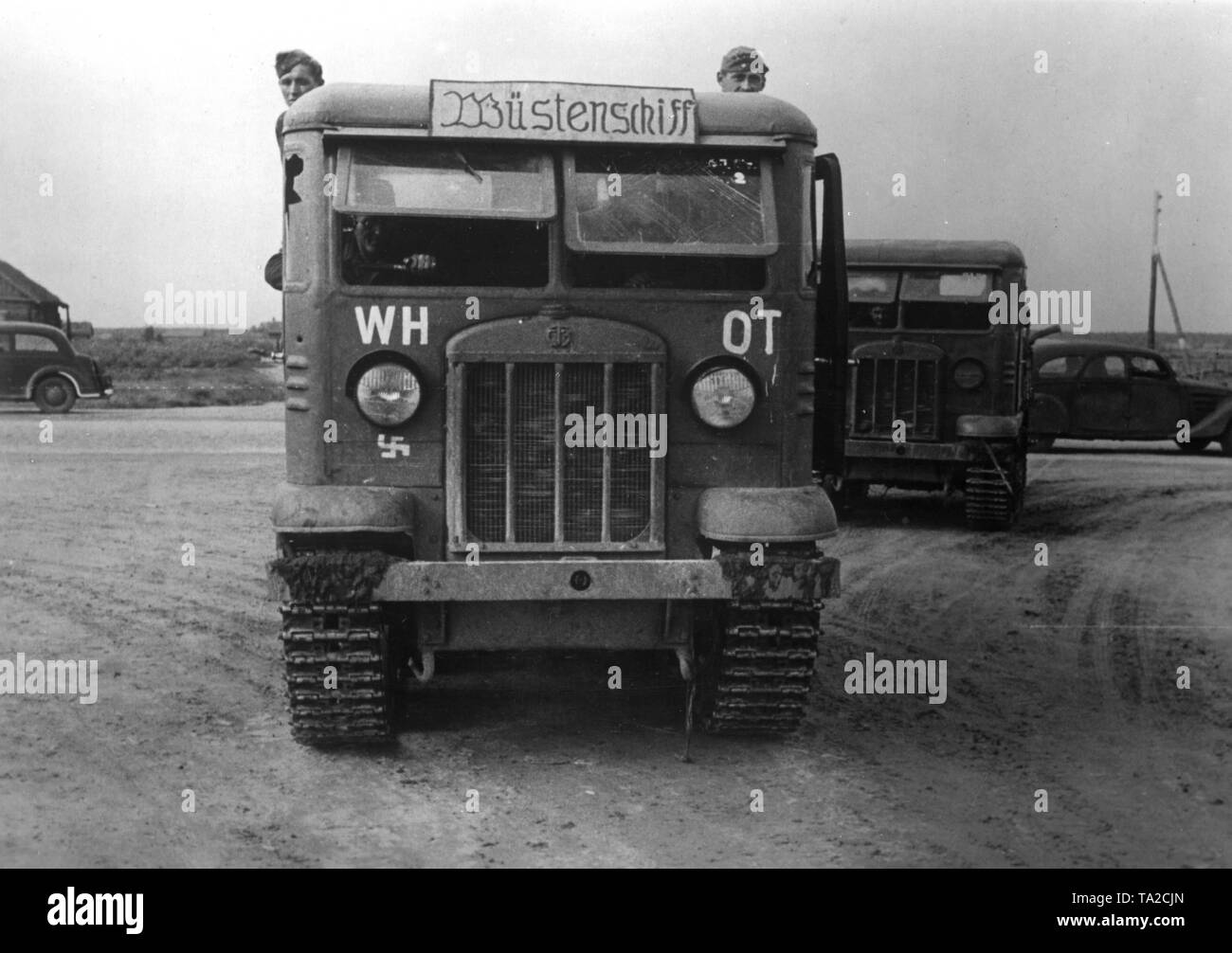 Trucks of the type Stalinec 3 (St 3) confiscated by the Germans from the artillery of the Soviet Army (on the front the lettering 'Wuestenschiff') for the Todt Organization, drive to the Eastern Front near Velikije Luki to repair the Soviet roads. War reporter: Friedrich. Stock Photo