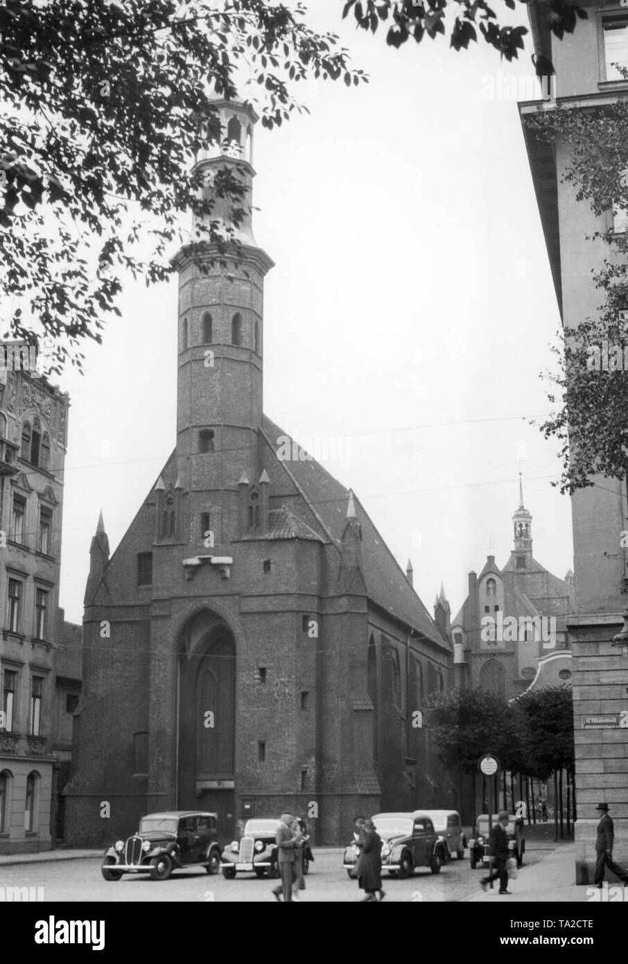 In the foreground the former garrison church St. Elisabeth and behind it the Weissmoenchenkirche in Danzig. The Church of St. Elisabeth was built from 1393 to 1417 and dates back to the Gothic period. St. Elizabeth was the second church of the Gdansk Evangelical Reformed Church. Stock Photo