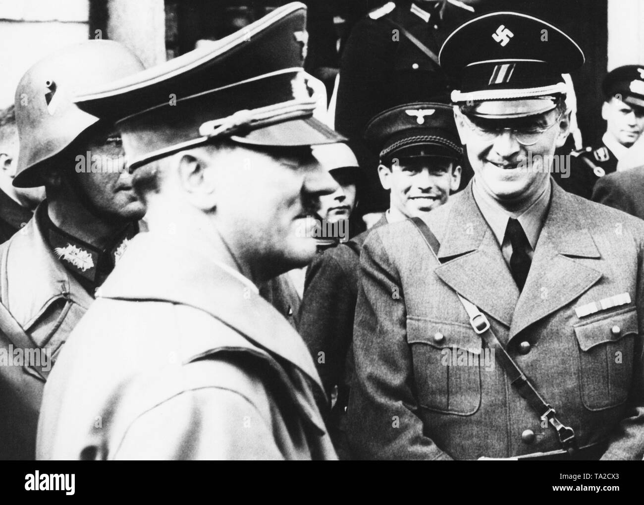 Gauleiter of the Sudetenland Konrad Henlein (right) with Adolf Hitler in the city of As on October 3, 1938, during the occupation of the Sudetenland. On the left, General Walter von Reichenau, Commander of the deployed troops. Stock Photo