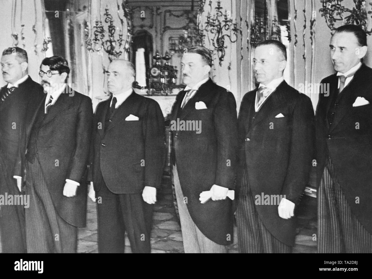 After the occupation of Bohemia and Moravia and the establishment of the Protectorate of Bohemia and Moravia, the new government is presented in Prague. From left to right: Dominik Cipera (Minister of Public Works), Vladimir Sadek (Minister of Trade), Johann Kapras (Education Minister), Alois Elias (Prime Minister), Ladislav Feierabend (Minister of Agriculture) and Josef Kalfus (Minister of Finance). Stock Photo