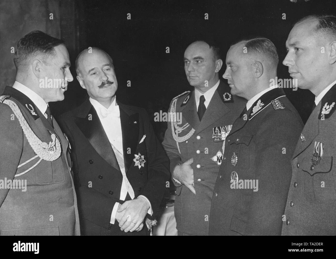 The Director of the Berlin Zoo Lutz Heck, the French Ambassador Andre Francois-Poncet, the Senate President of Danzig Arthur Greiser and the Generalforstmeister (General forest supervisor) Friedrich Alpers in conversation on the occasion of a ball in the Zoo, for hunters who travelled to the International Hunting Exhibition. Stock Photo