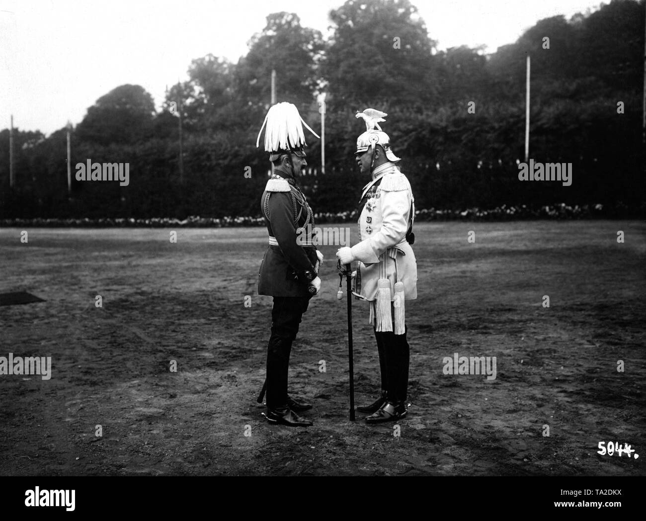 Emperor Wilhelm II (left) and Egon Maximilian II Prince of Fuerstenberg in conversation .The emperor can be seen in General Field Marshal uniform with a baton.The Prince is wearing the uniform of the cuirassier Gardes du Corps with the accompanying eagle helmet. Stock Photo