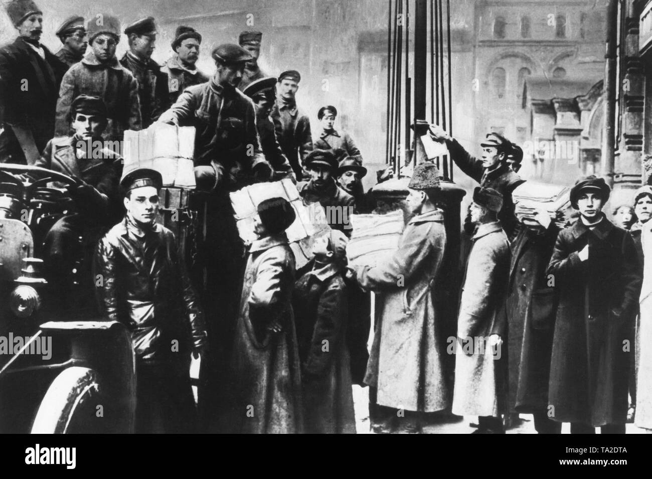 Workers and soldiers transport ballot papers to the counting center. When the elected parliament wanted to meet for the first time on January 18, 1918, Lenin had it forcibly dissolved, because his Bolshevik party could not obtain a majority of votes. Stock Photo