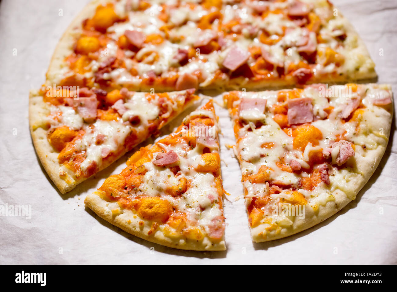 Pizza with cheese, ham and prosciutto Stock Photo Alamy