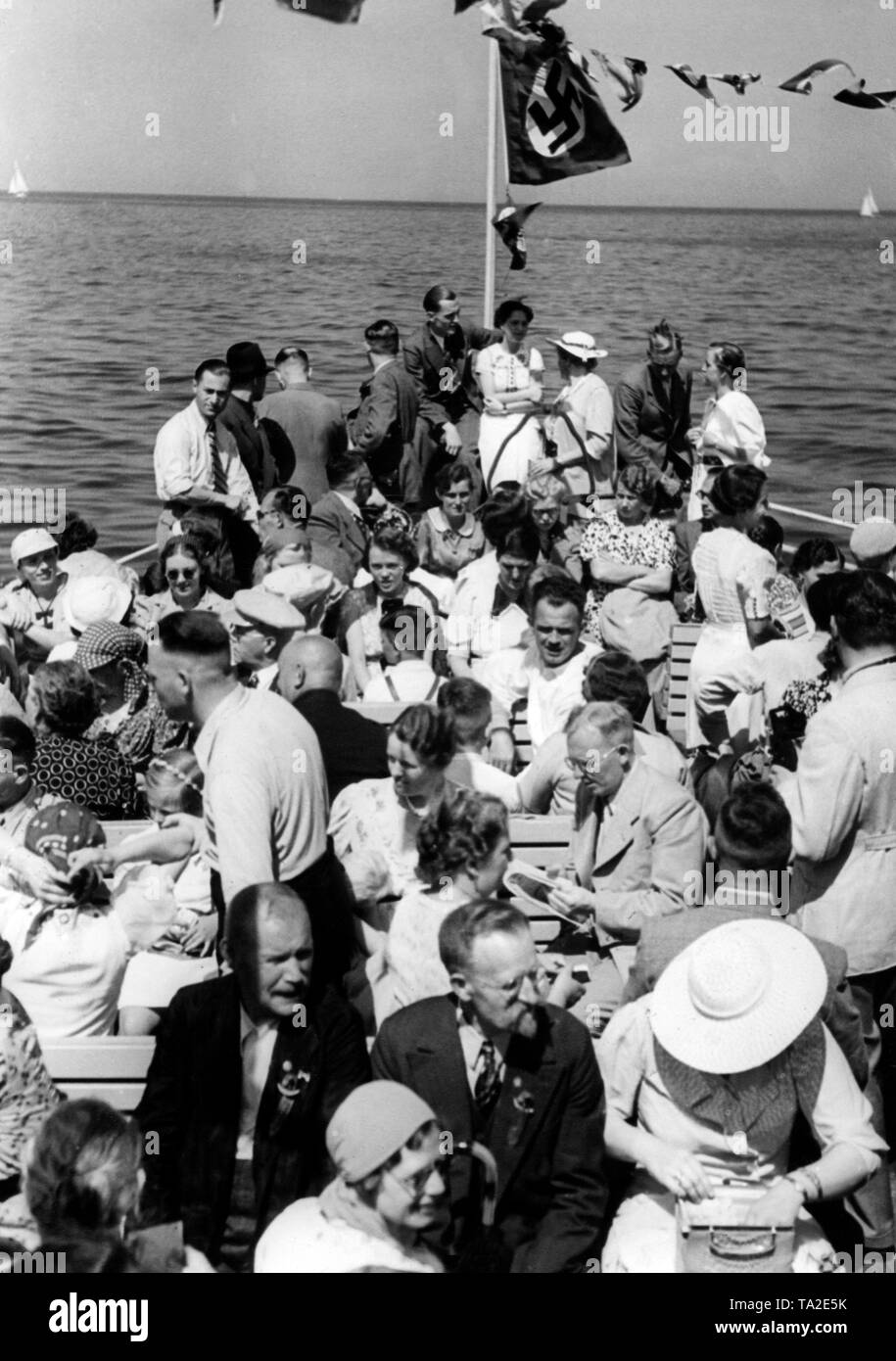 Vacationers of the Nazi organization 'Kraft durch Freude' ('Strength through Joy') are traveling on a boat from Sopot to a city tour in Gdansk. Stock Photo