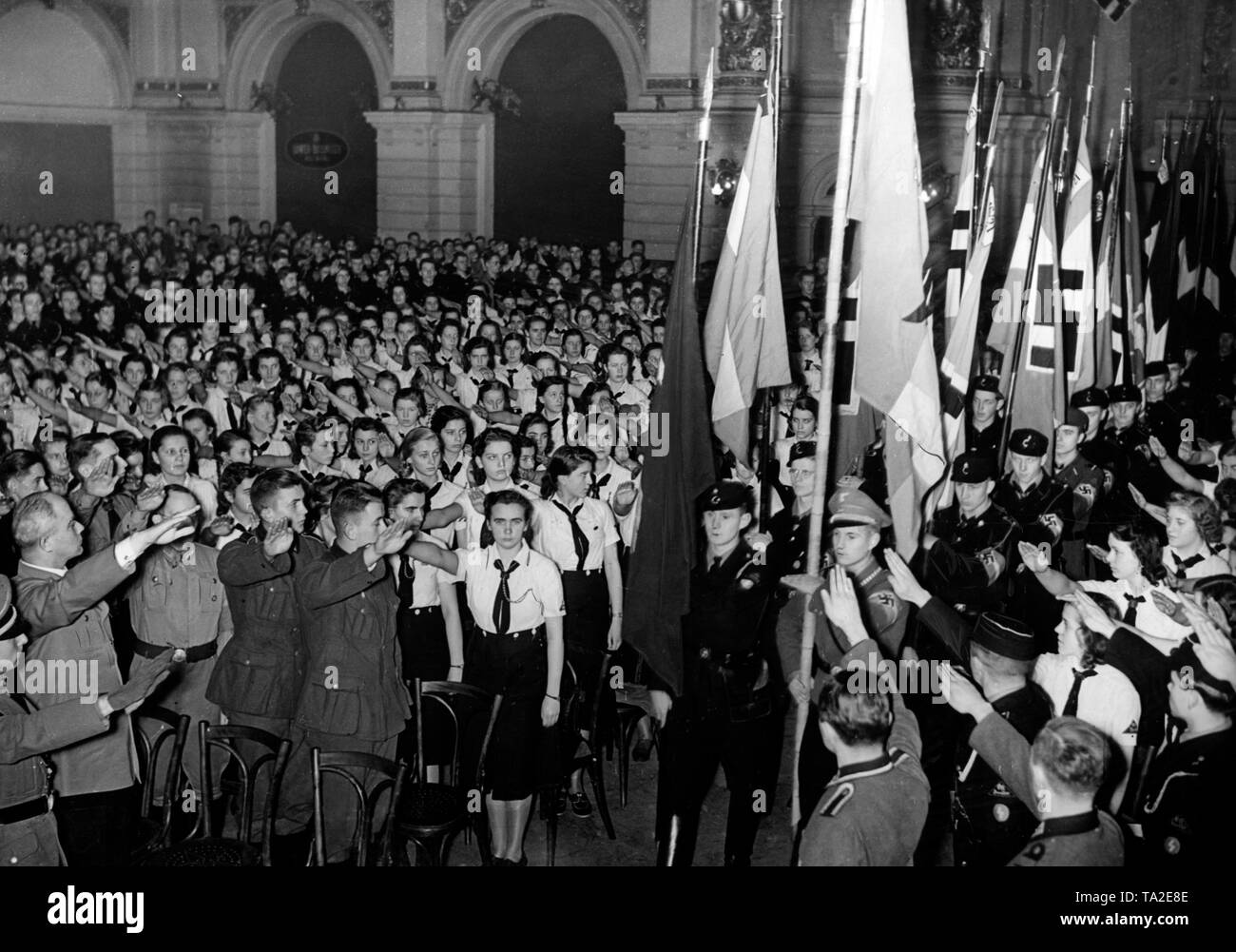 For propagandistic influence 'educational events' were ordered for the youth -here in Friedrichshain, where Gauleiter Goerlitzer gives a speech.  Here, members of the Wehrmacht, of the Hitler Youth and of the BDM. On the far left, Gauleiter Goerlitzer performs  the Hitler salute. Stock Photo