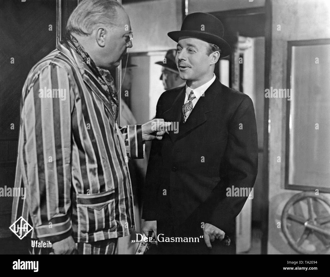 Heinz Ruehmann as Hermann Knittel (right) and Walter Steinbeck as an unknown gentleman in the film 'The Gasman' by Carl Froehlich, based on the novel by Heinrich Spoerl. Stock Photo