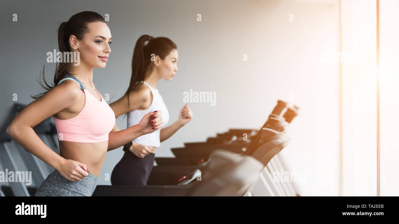 Training together. Women doing cardio workout, copy space Stock Photo