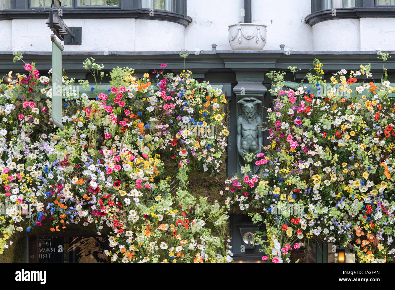 The Ivy Chelsea Garden restaurant wildflower inspired floral display in Kings road for Chelsea in Bloom 2019. Chelsea, London, England Stock Photo