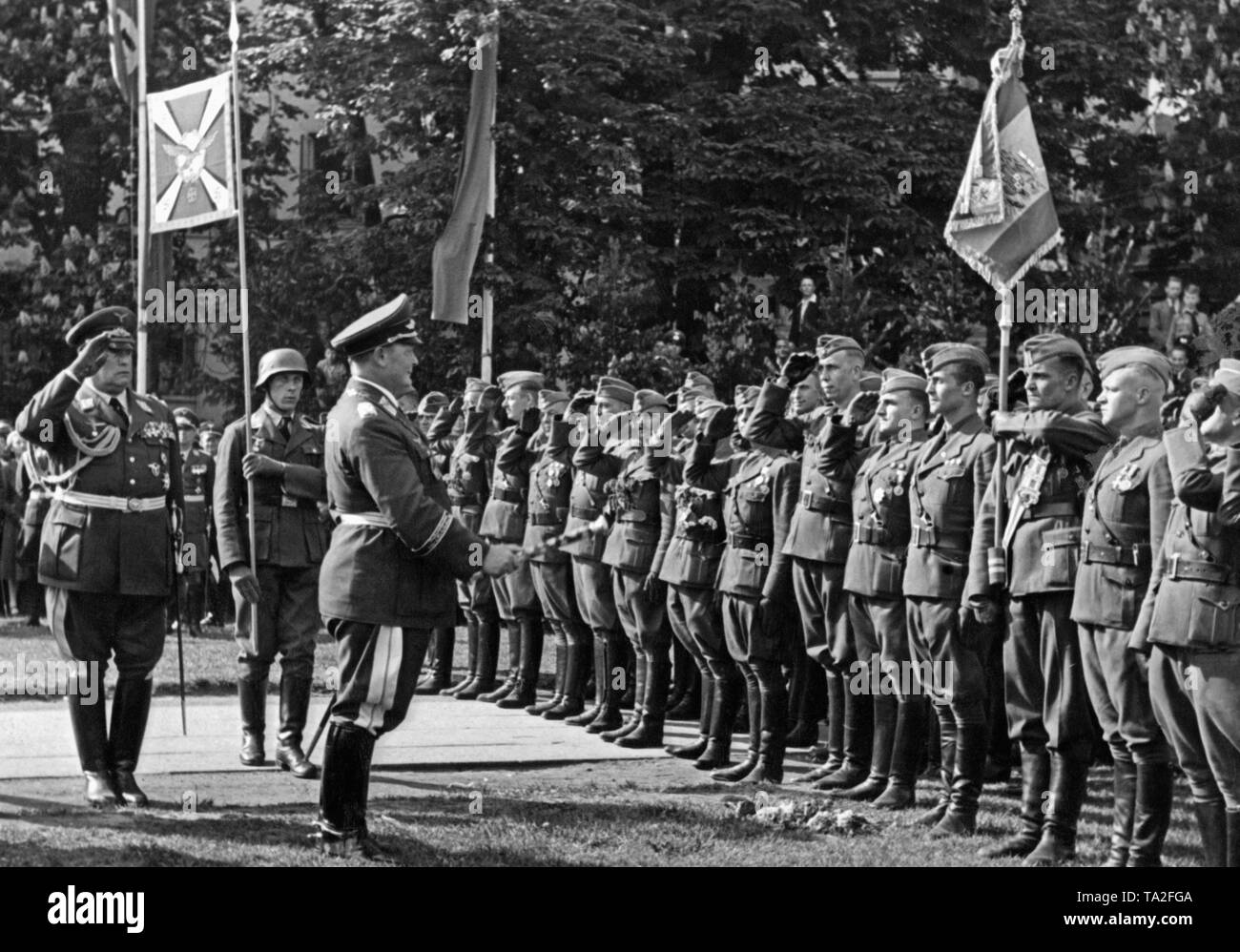 Photo of Field Marshal General, Hermann Goering (commander-in-chief of the Luftwaffe) welcoming pilot officers of the Condor Legion in the Moorweide (Hamburg) at Hamburg Dammtor on May 30, 1939. General der Flieger Hugo Sperrle is saluting to his left. Stock Photo