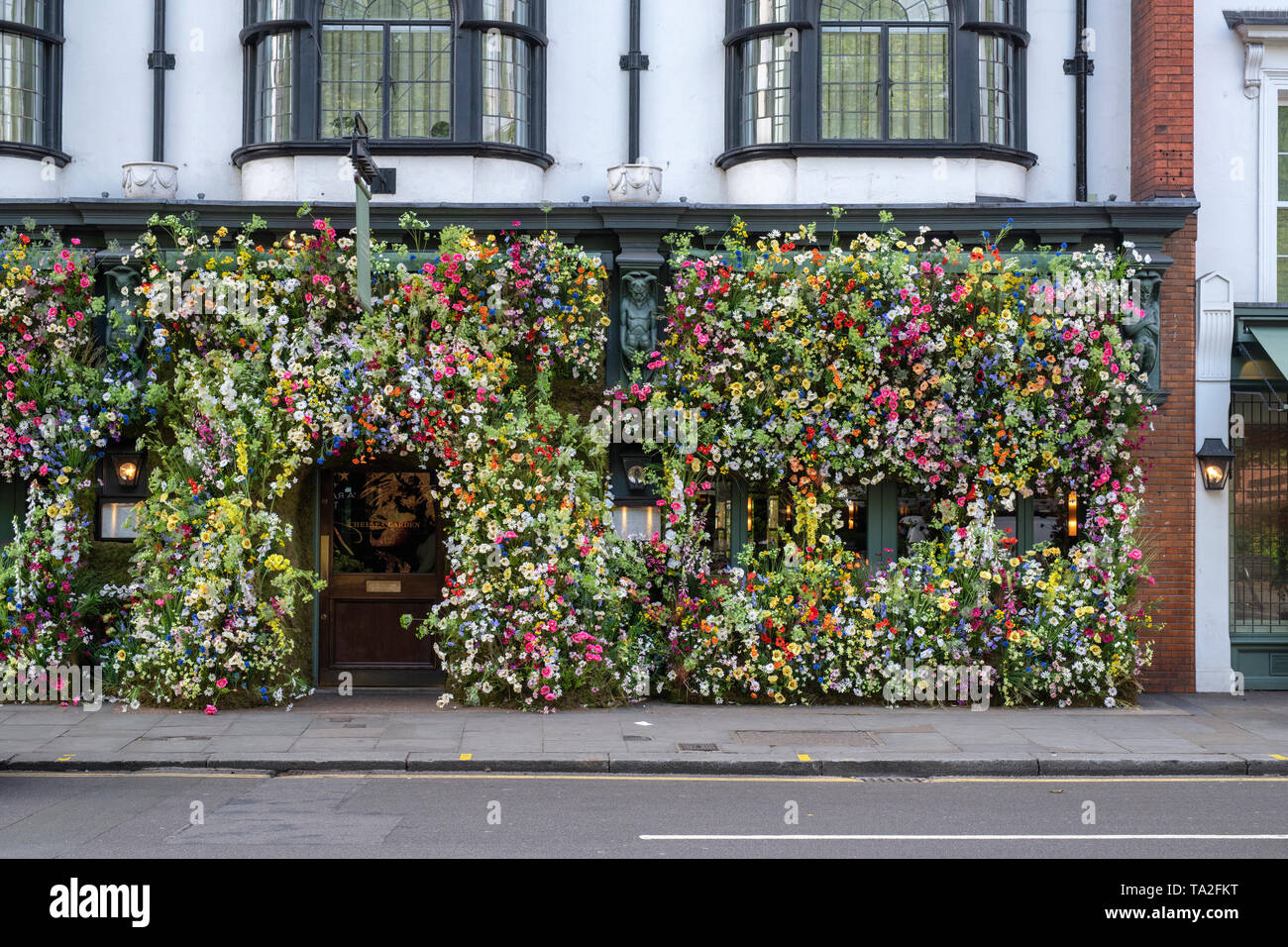 The Ivy Chelsea Garden restaurant wildflower inspired floral display in Kings road for Chelsea in Bloom 2019. Chelsea, London, England Stock Photo