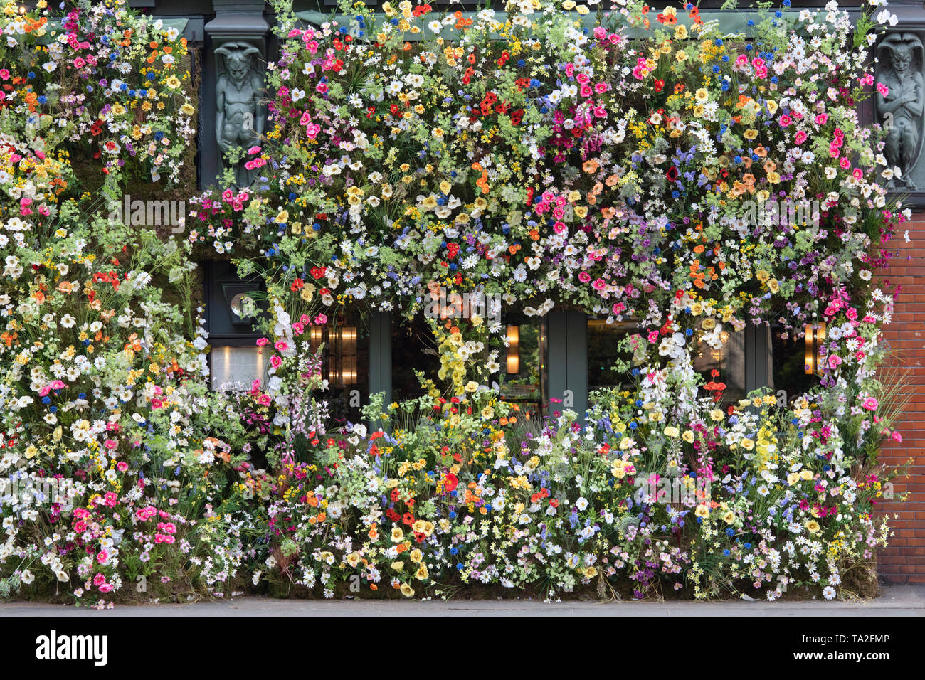 The Ivy Chelsea Garden restaurant wildflower inspired floral display in Kings road for Chelsea in Bloom 2019. Chelsea, London, England Stock Photo