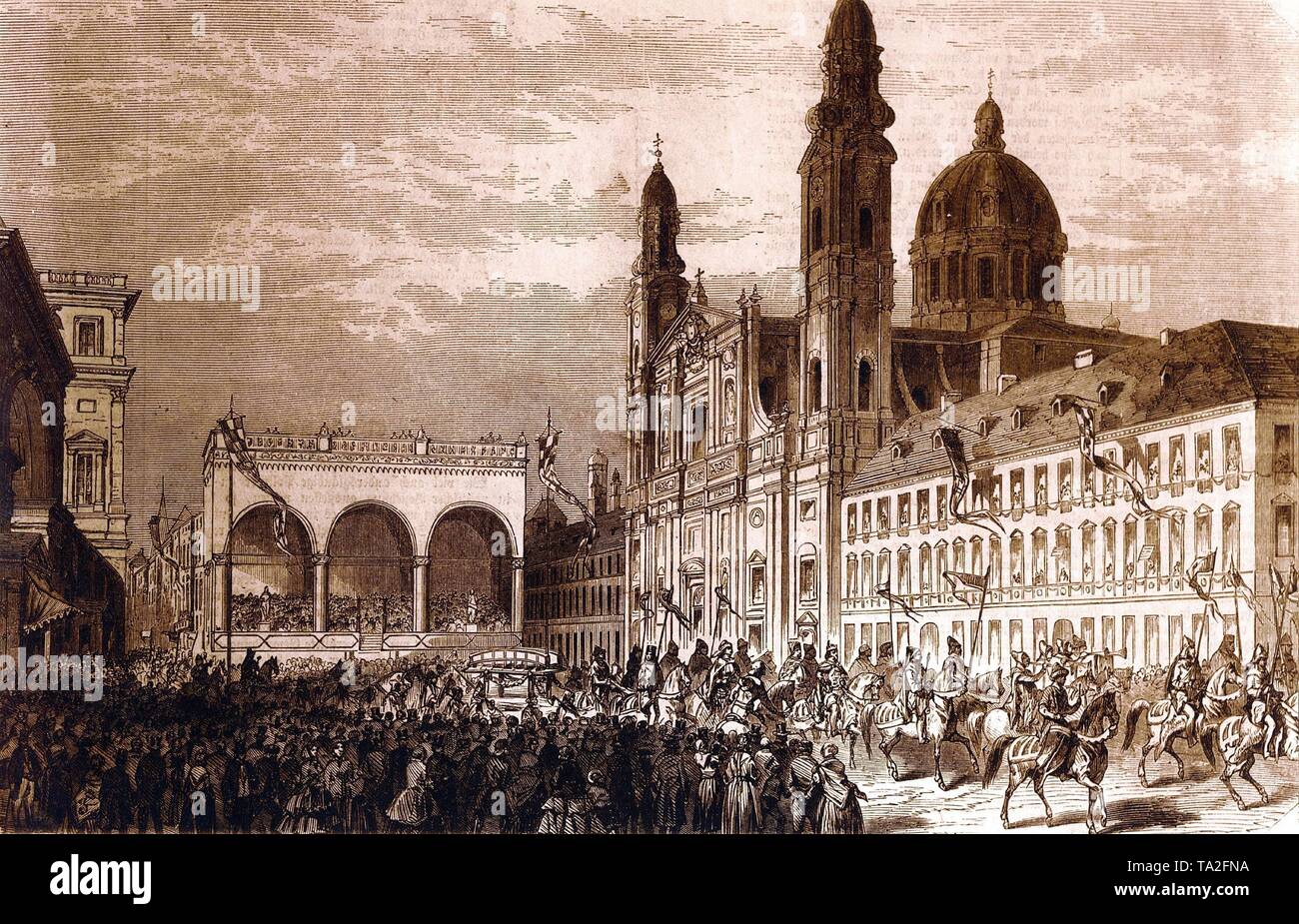 Anniversary procession on Odeonsplatz. In the background, the Residenz (left), the Feldherrnhalle (middle) and the Theatiner Church (right). Stock Photo