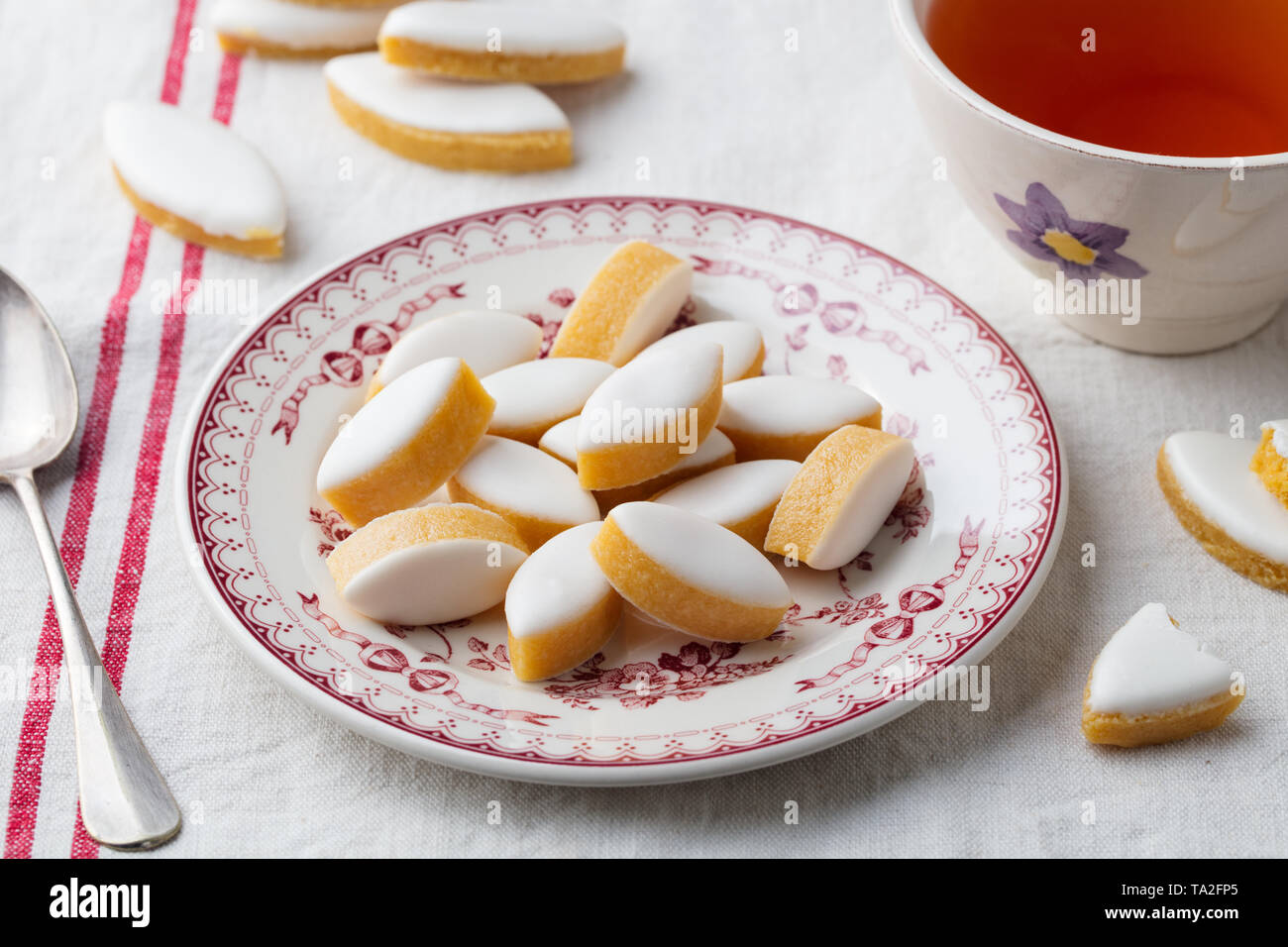 Calissons on a plate. Traditional French Provence sweets with cup of tea. Stock Photo