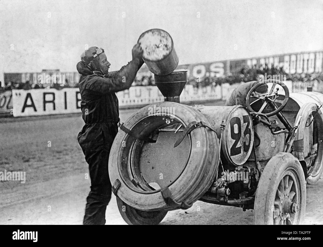 The Benz 150 hp with the number 23 of the French racing driver Rene Hanriot is refueled during the French Grand Prix 1908 in Dieppe. Stock Photo