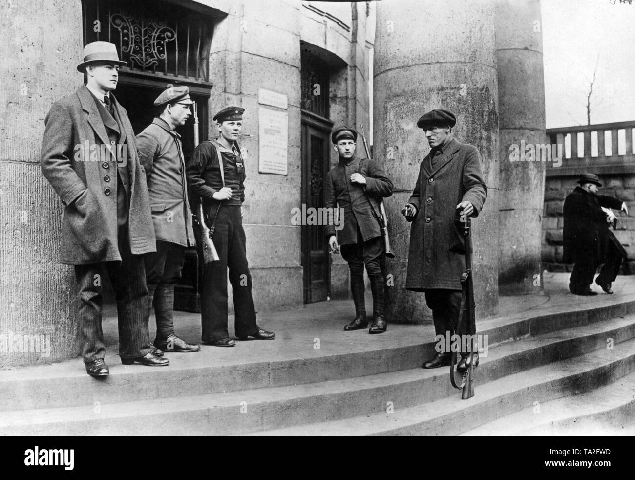 Guards of the Red Army at the General Post Office building. Two days after the beginning of the Kapp Putsch in Berlin, a Communist insurrection broke out in the Ruhr area. The attacking Freikorps are repulsed by the workers, only the Reichswehr that intervenes on the 2nd of April succeeds to suppress the insurrection after bloody battles until the 10th of May. Stock Photo