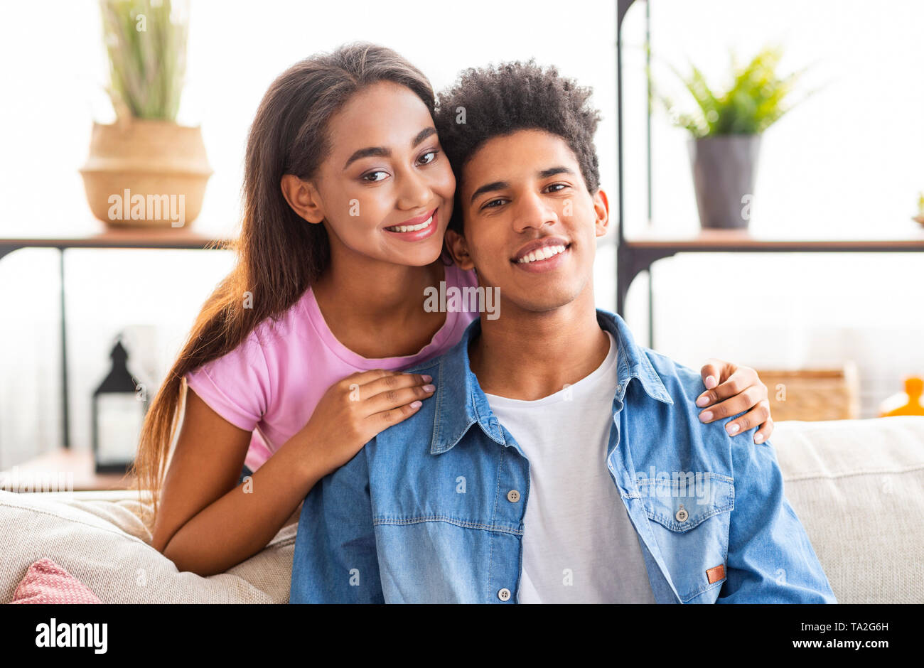 Romantic African American Teenage Couple Smiling At Camera Stock Photo