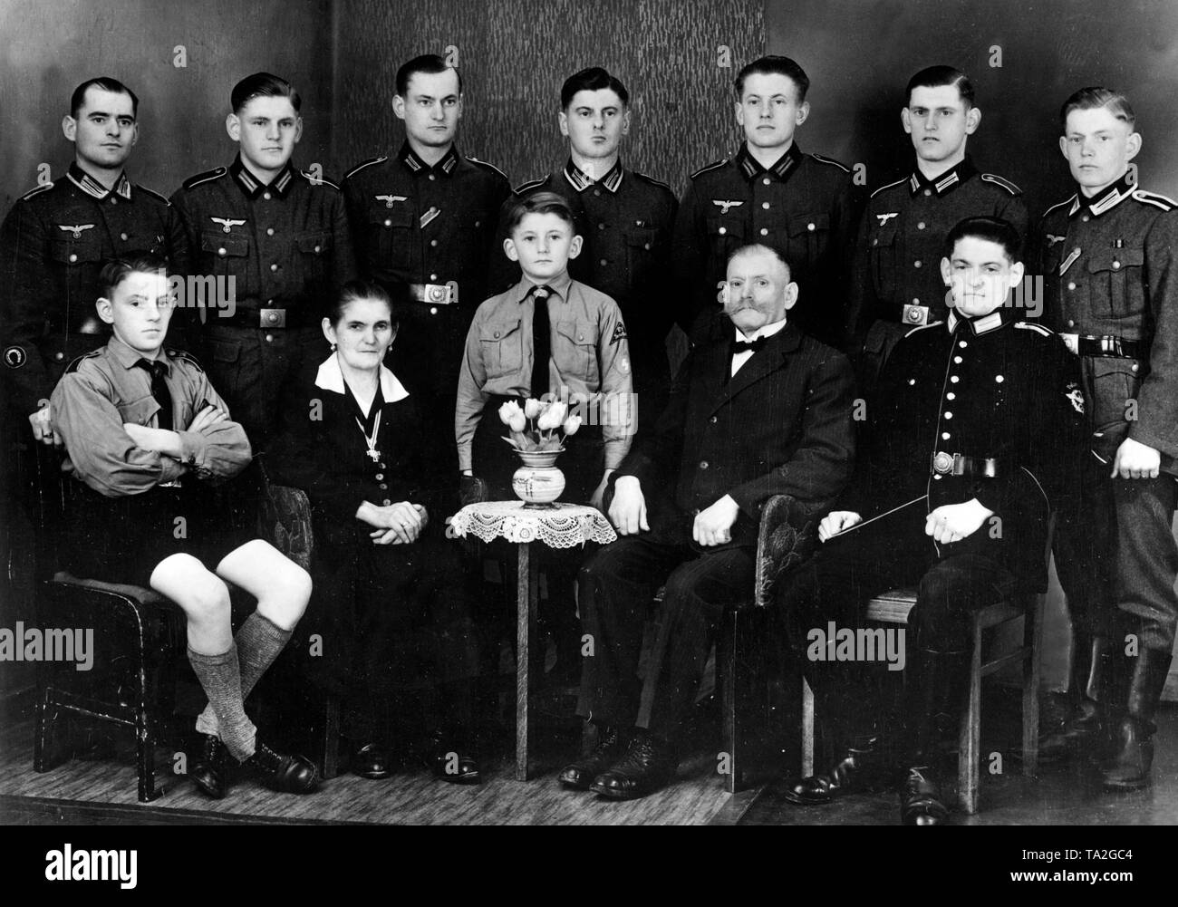 Family photo of a family from Koepprich in the district of Glatz in Silesia. The older sons standing in the back row were all members of the Wehrmacht. The young man on the right served at the Feuerloeschpolizei (fire police), the two boys were members of the Hitler Youth. The mother of the family was awarded the golden Cross of Honour of the German Mother. Photo: Gottschlich Stock Photo