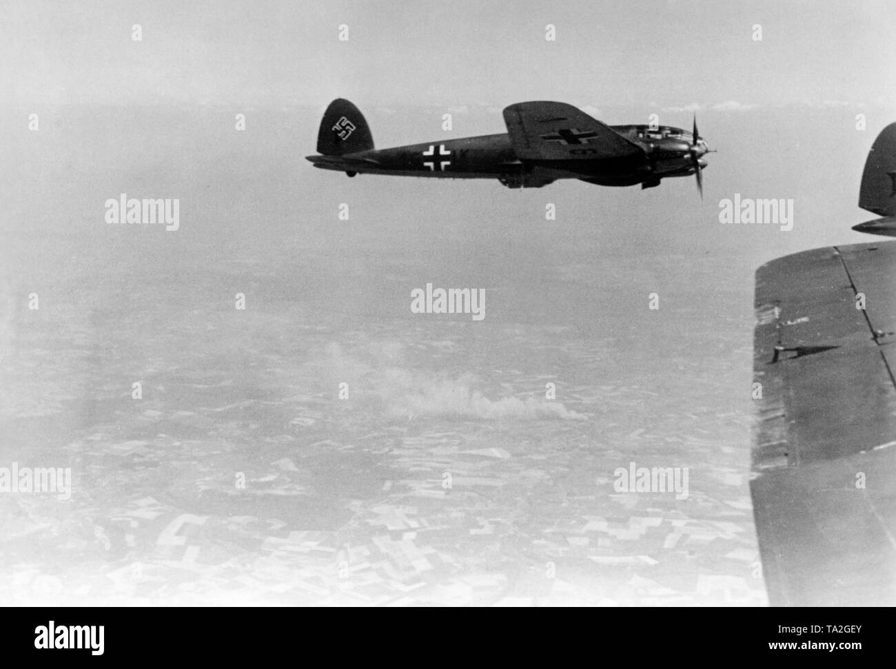 WW2 Picture Photo German He 111 during a attack fuel dumps 3083