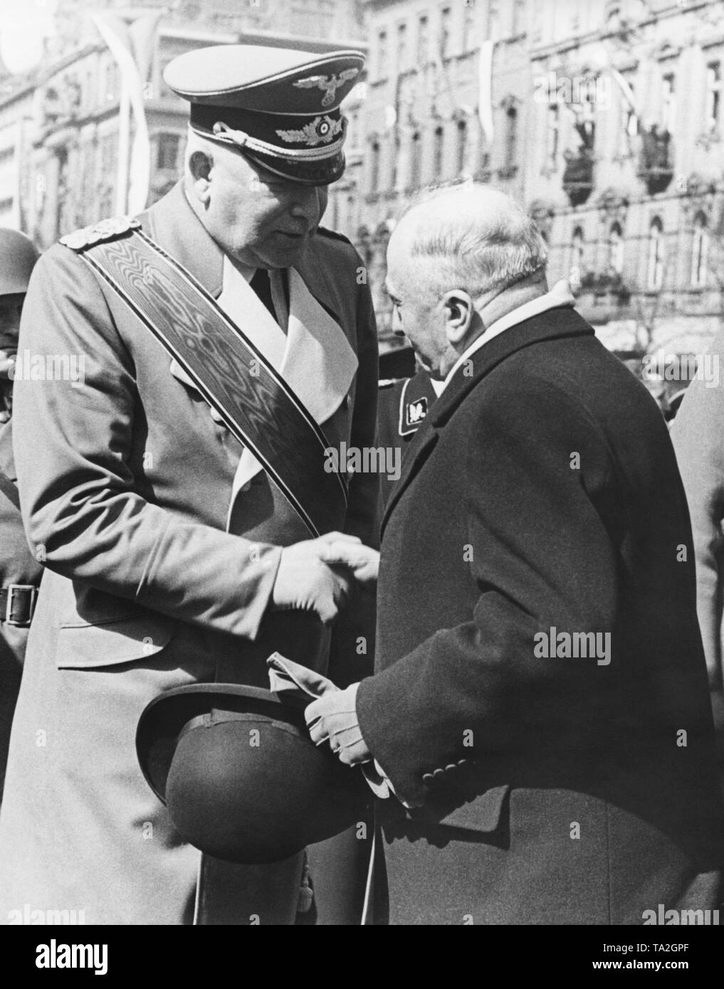 The Reich Protector of Bohemia and Moravia, Konstantin von Neurath, bids farewell to the Czech Head of State Emil Hacha. Previously, a parade took place at Wenceslas Square. In March 1939, the Czech territories were occupied by the Wehrmacht and the Protectorate of Bohemia and Moravia was established. Stock Photo