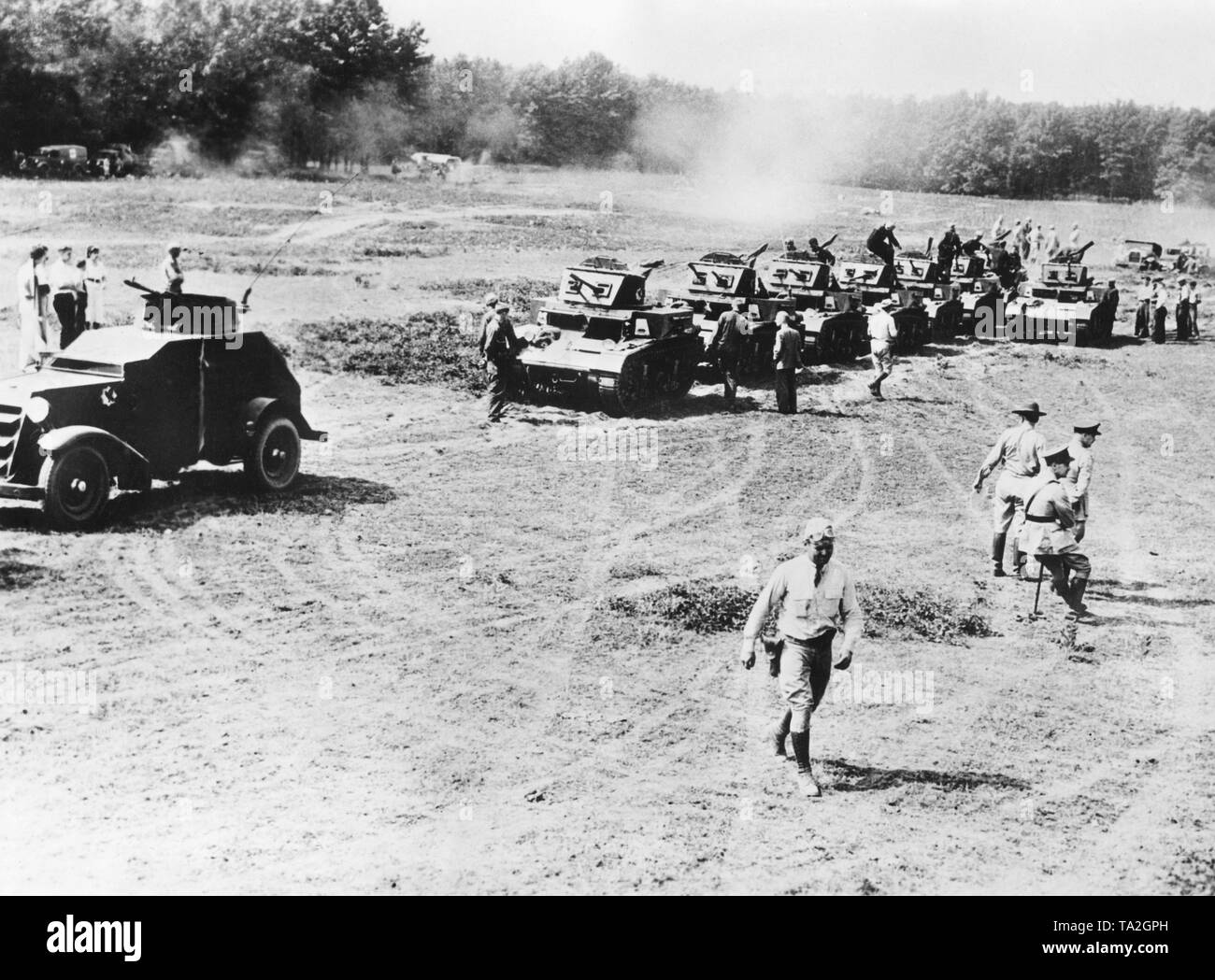 Photo a maneuver of the 424th American Infantry Regiment along with tank departments. What the Americans were trying to do here in the 1930s was to bring the armored car to its position of supremacy in attack operations at the end of the century. The air attack with special bullets ended the battlefield dominance of the armored vehicle (also called 'tank'). It was slow and too easy to hit and destroy. Stock Photo