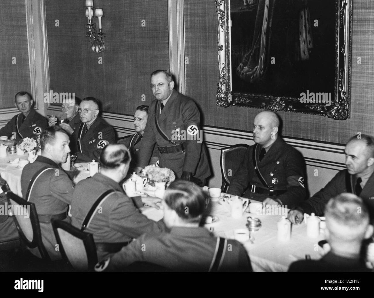 On the occasion of the 16th anniversary of the Stahlhelm, leader Franz Seldte (center, standing) speaks to the press at the 'Magdeburger Hof' hotel. On the left beside him, the leader Hubold, to his right, chief press officer of the Stahlhelm, Hans von Wick. Stock Photo