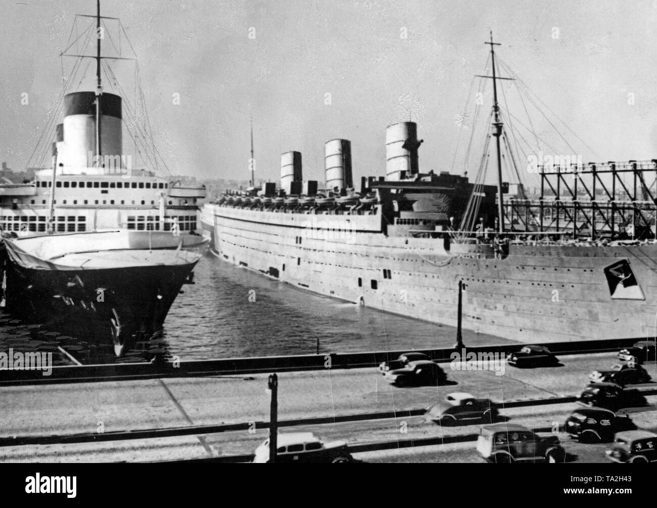The ocean liners 'Normandie' and 'Queen Mary' during their laytime in the harbor of New York. Stock Photo