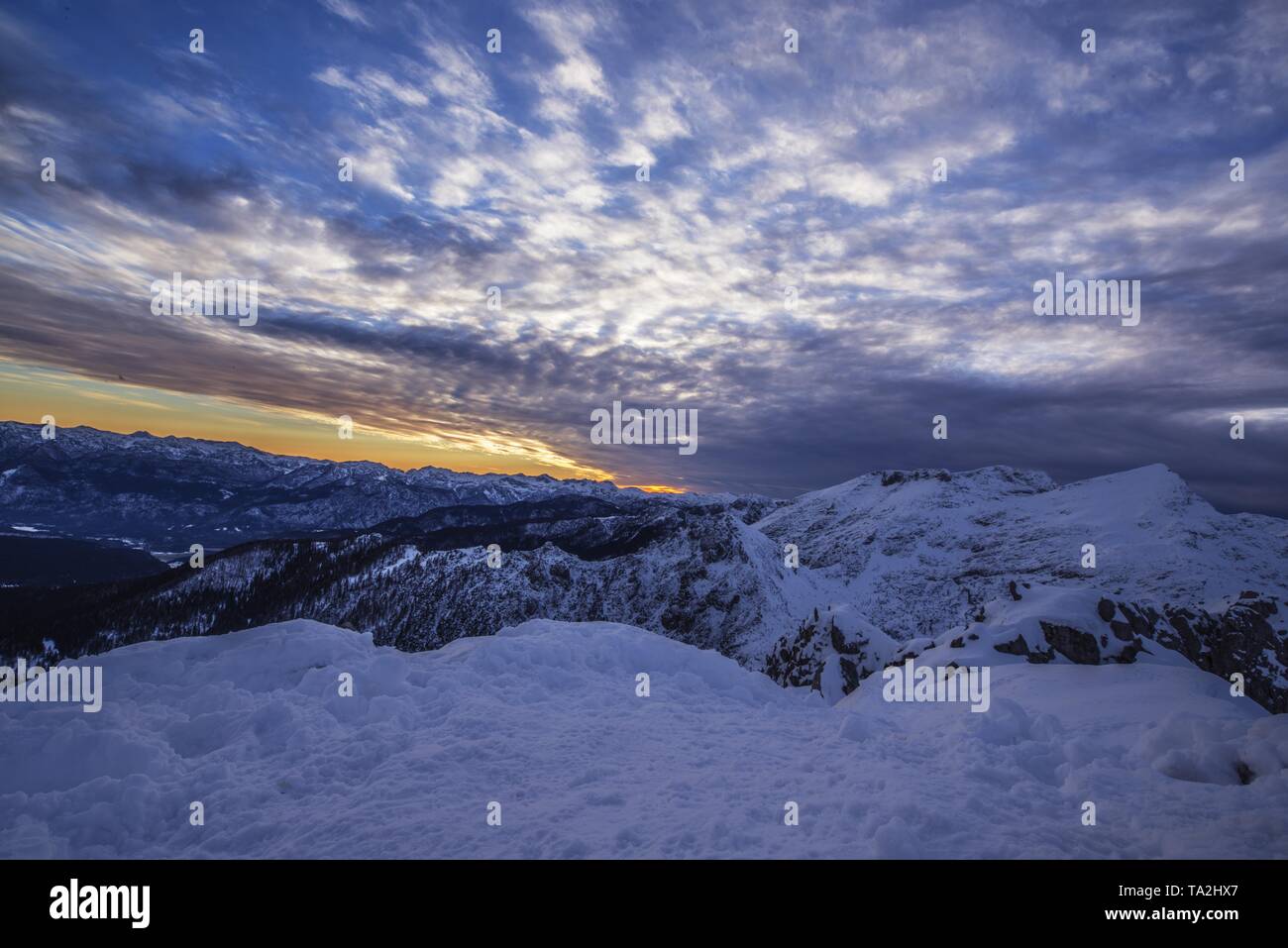 Sunset in the snowy mountains in a spectacular atmosphere Stock Photo ...