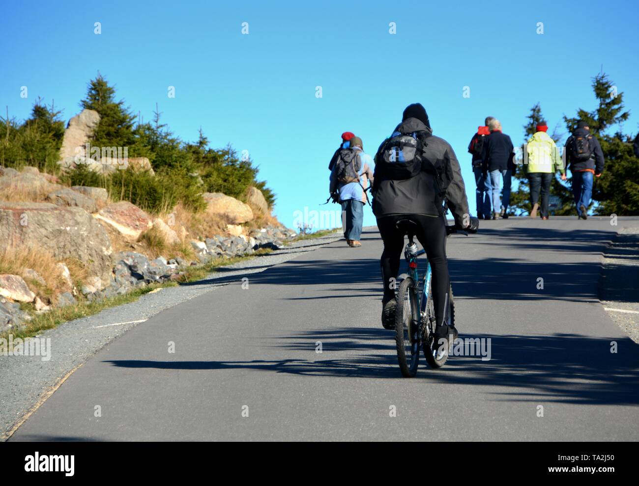 a cyclist on the way to the summit of Brocken in the Harz National Park Stock Photo