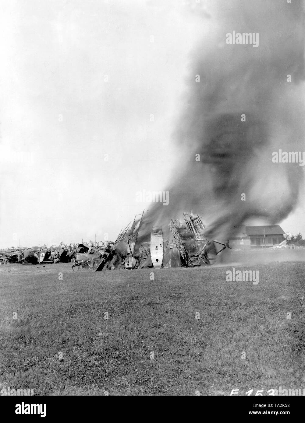 Imperial hunting aircrafts are burned on the Griesheim military airfield according to the Treaty of Versailles. Stock Photo
