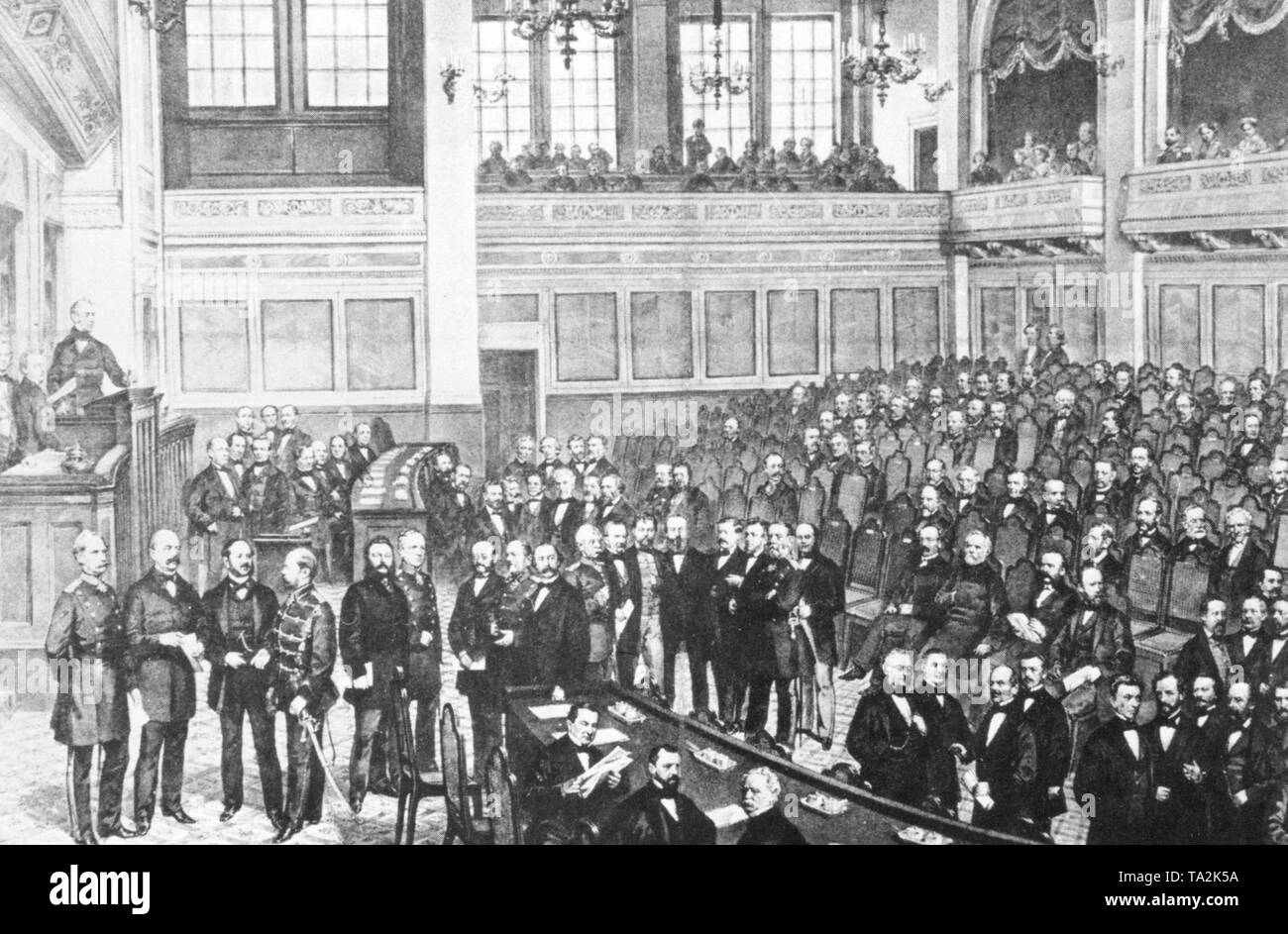 The Reichstag was composed of 397 deputies who come from universal, equal, direct and secret elections. The drawing shows the meeting, which was attended among others by the Minister of War, Albrecht von Roon (far left below), the Prussian Prime Minister, Otto von Bismarck (right beside), and the Prussian Chief of General Staff Helmut von Moltke (6th from left). Undated picture. Stock Photo