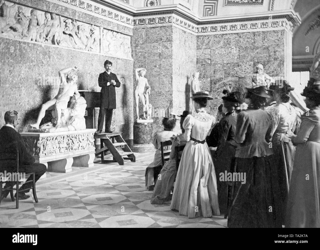 The archaeologist Adolf Furtwangler delivers a lecture to students at the Glyptothek in Munich. Stock Photo