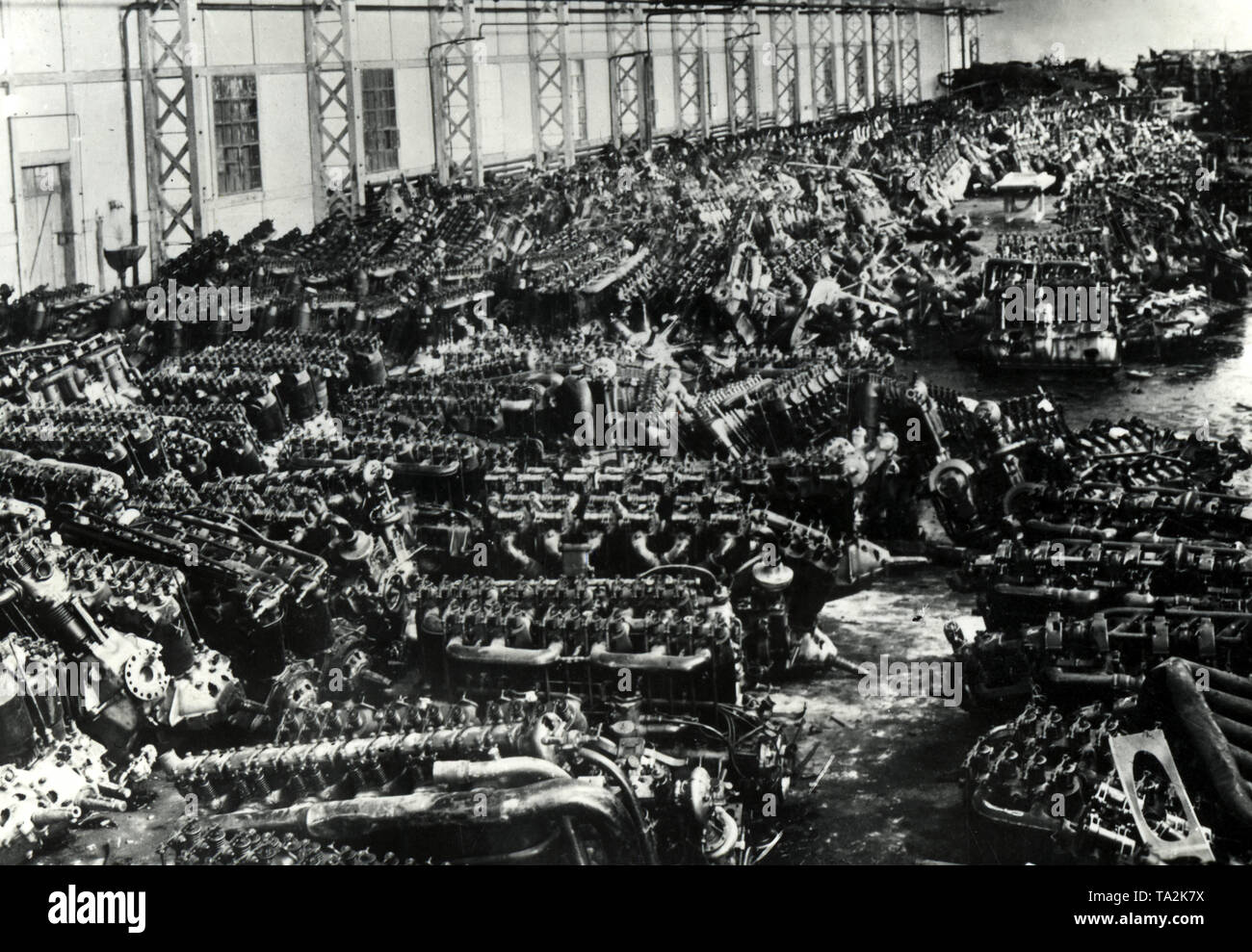 The destruction of all the combat aircrafts carried out in accordance with the regulations of the Versailles Treaty resulted in a gigantic scrap yard full of aircraft engines (undated photo). Stock Photo