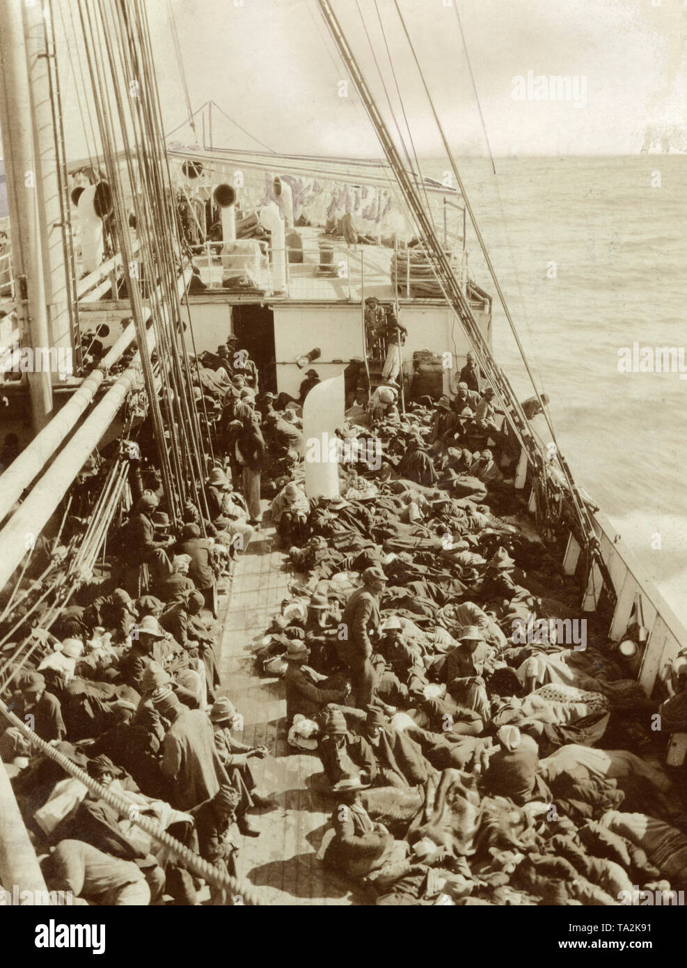 A ship transports local workers to Swakopmund, German South West Africa. Stock Photo