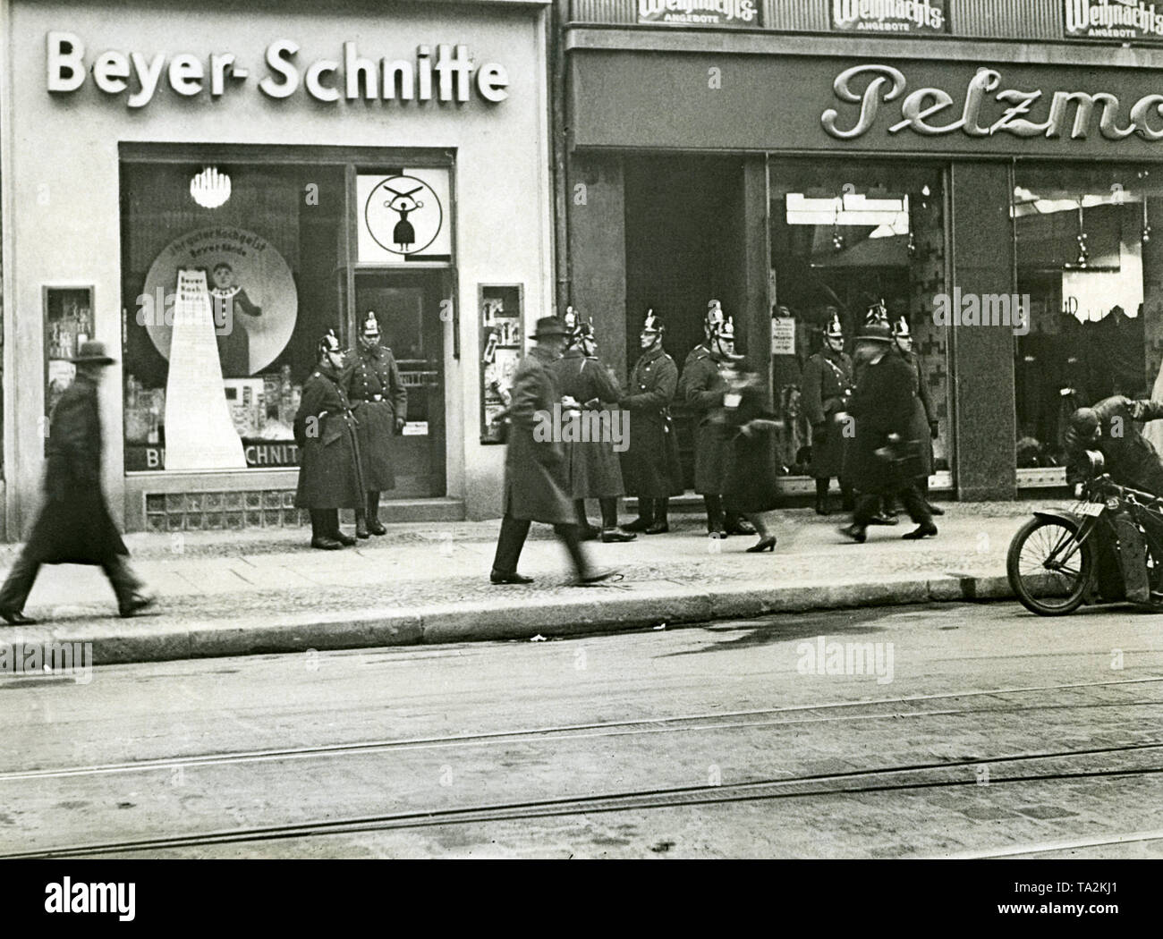 There are street fights between the Rotkaempferbund and the SA, during which the police secures the pavement opposite the Berlin City Hall. Stock Photo