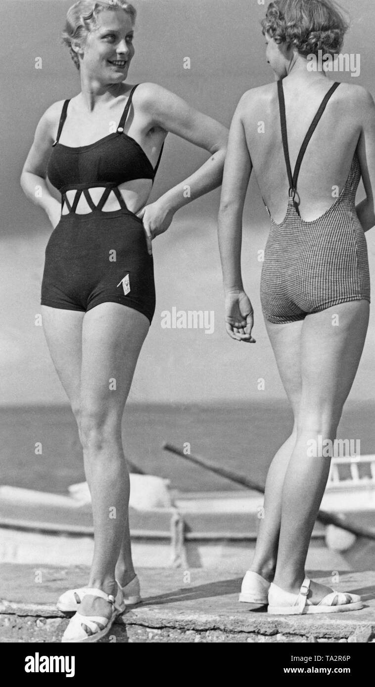 Two women pose in tight swimsuits Stock Photo - Alamy