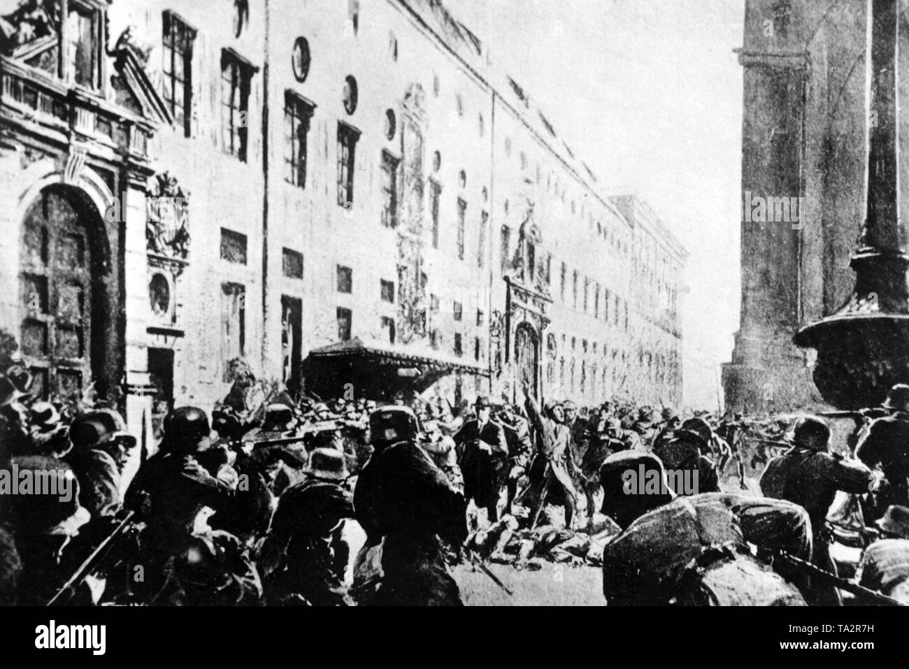 The Bavarian State Police (foreground) opens fire on the putschists. In the center stand Adolf Hitler with an outstretched arm and right of him, General Erich Ludendorff. The buildings in the background are the Residenz (left) and the Feldherrenhalle (right) in Munich. Stock Photo