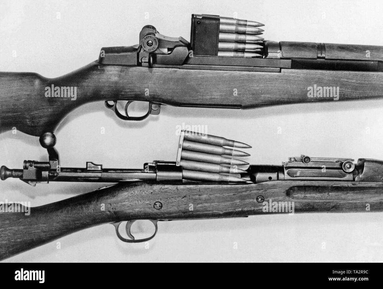Above: M1 Garand, autoloading rifle (semi-automatic) with a 8-shot magazine. Below: Springfield M1903, repeating rifle with a 5-shot magazine. Stock Photo