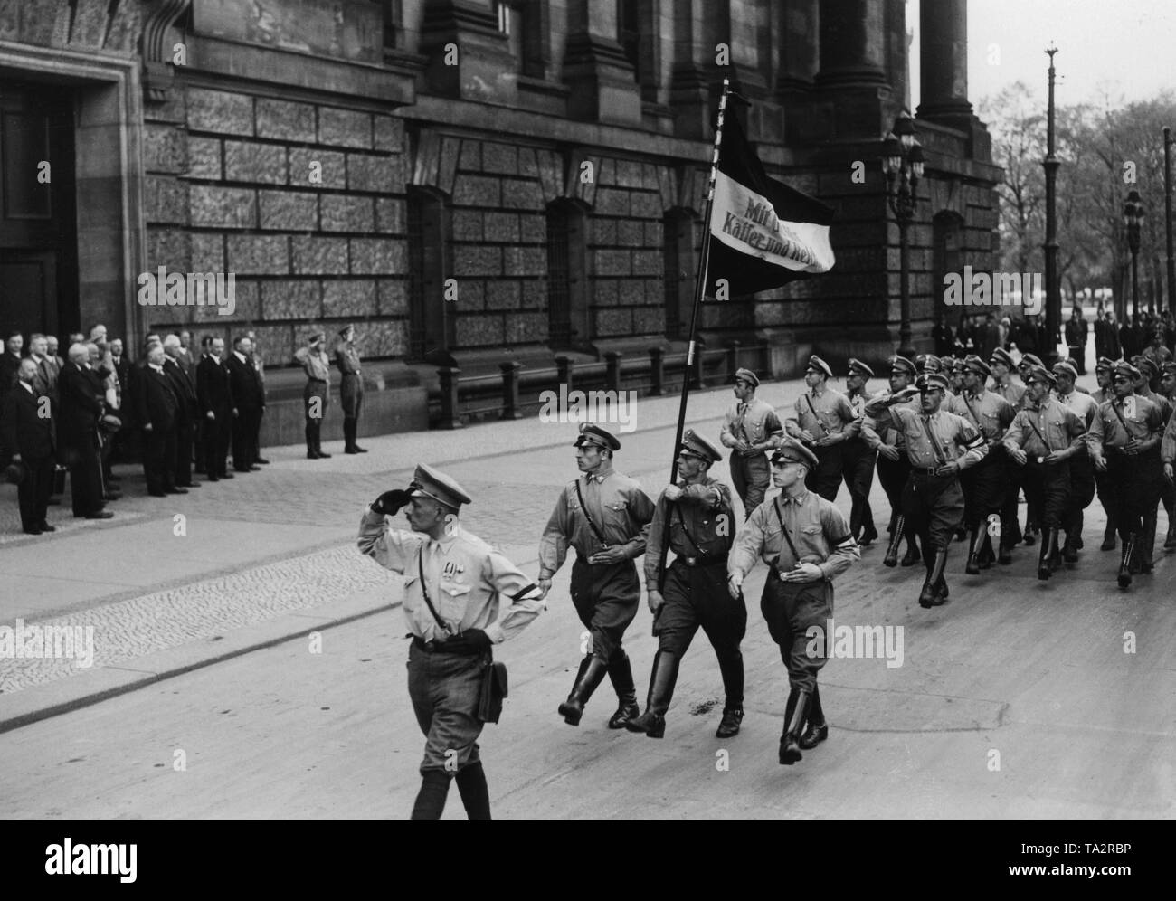 At the board meeting of the German National People's Party in the Reichstag, a division of the Kampfring junger Deutschnationaler marched to the 5th portal of the Reichstag in honor of Adolf Hitler. On the left, the leadership of the DNVP. In the center chairman of the party, Alfred Hugenberg. Stock Photo